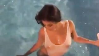 coming out of the pool in a sheer swimsuit(video )