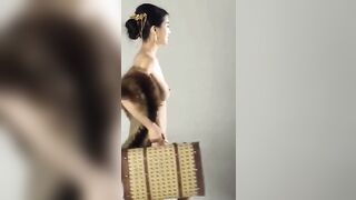 Perfectly Demure Chinese Model Poses Nude