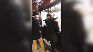Guy pretending to be a guard asks for ID to see if they are old enough to buy a kebab