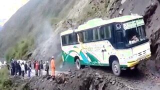 Bus crossing a narrow mountain pass (SFW) | Stretching his ass with four fingers (NSFW)