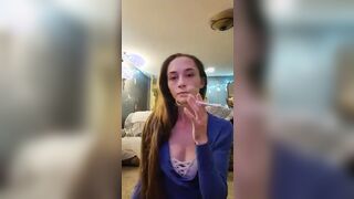 Kayla smoking a Marlboro light 100