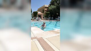 Busty blonde gets out of the pool